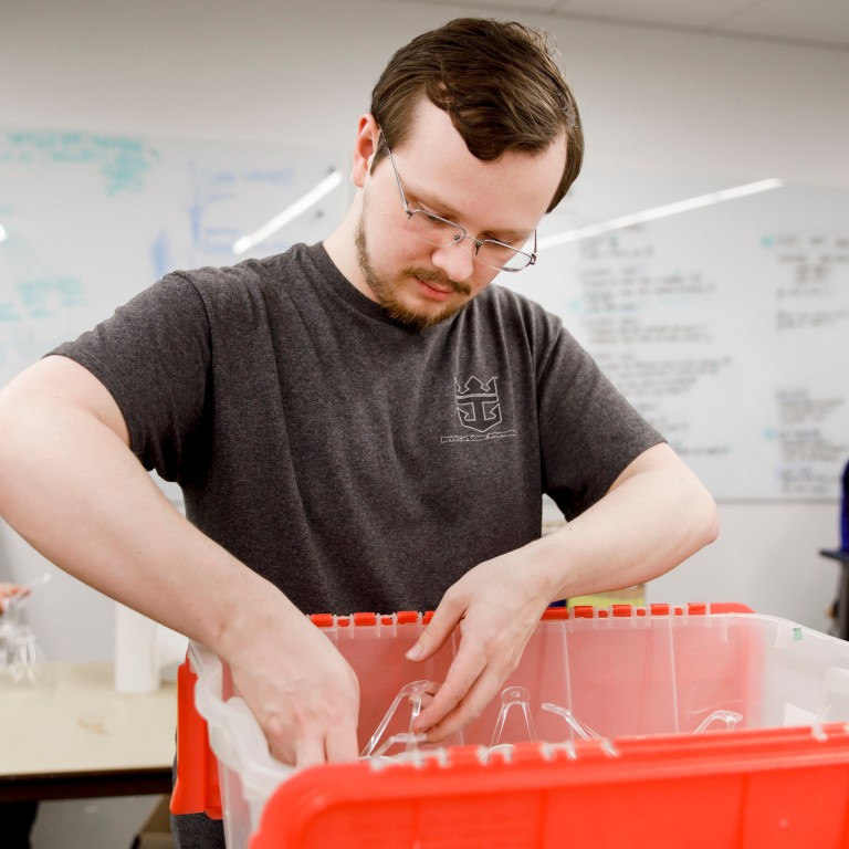 IU senior Nick Root packages vinegar batteries for installation in 'Amatria'